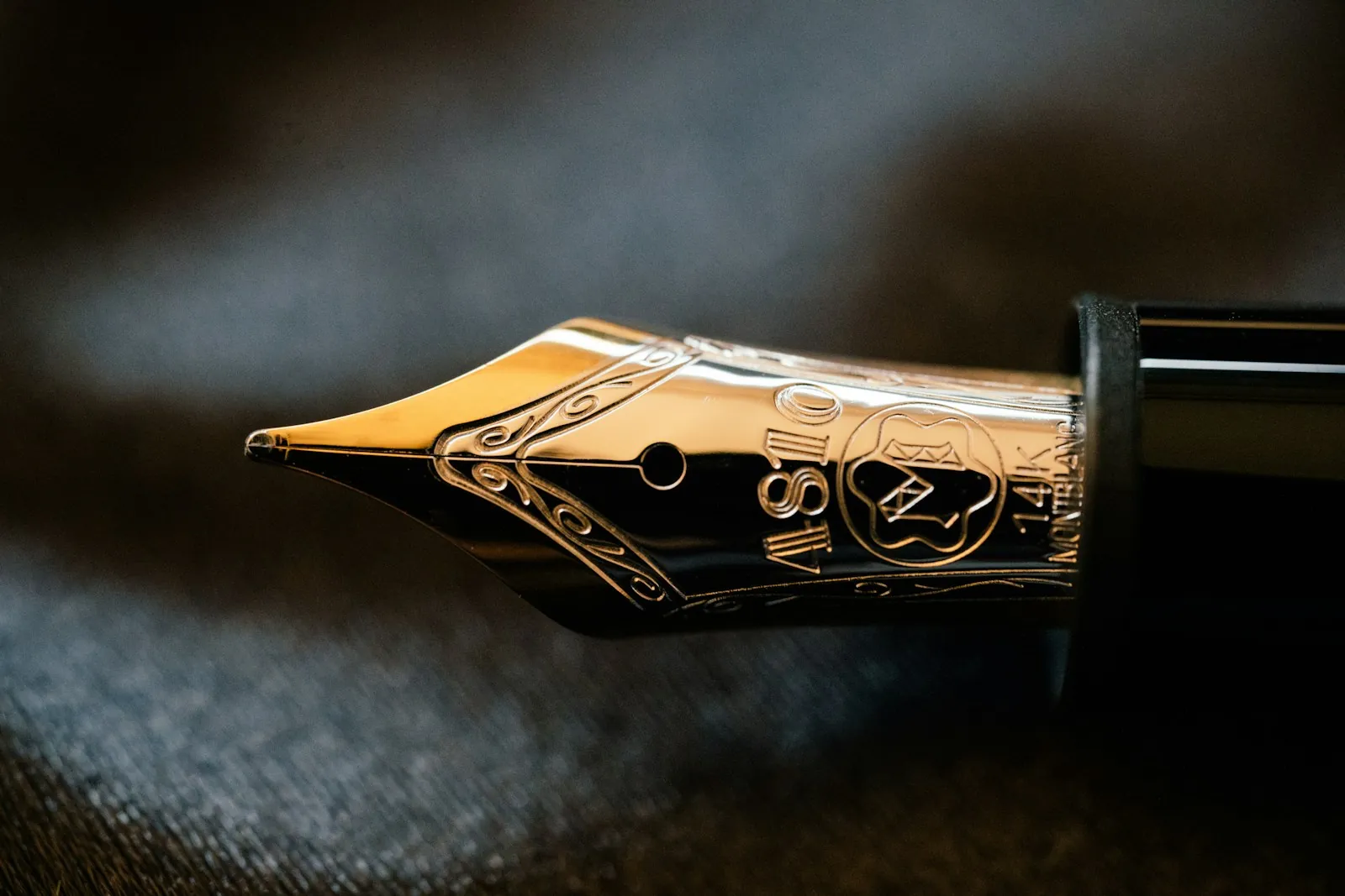Gold-nib fountain pen in low light